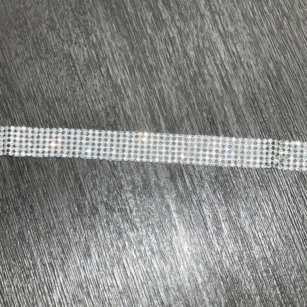 Silver bejeweled choker.